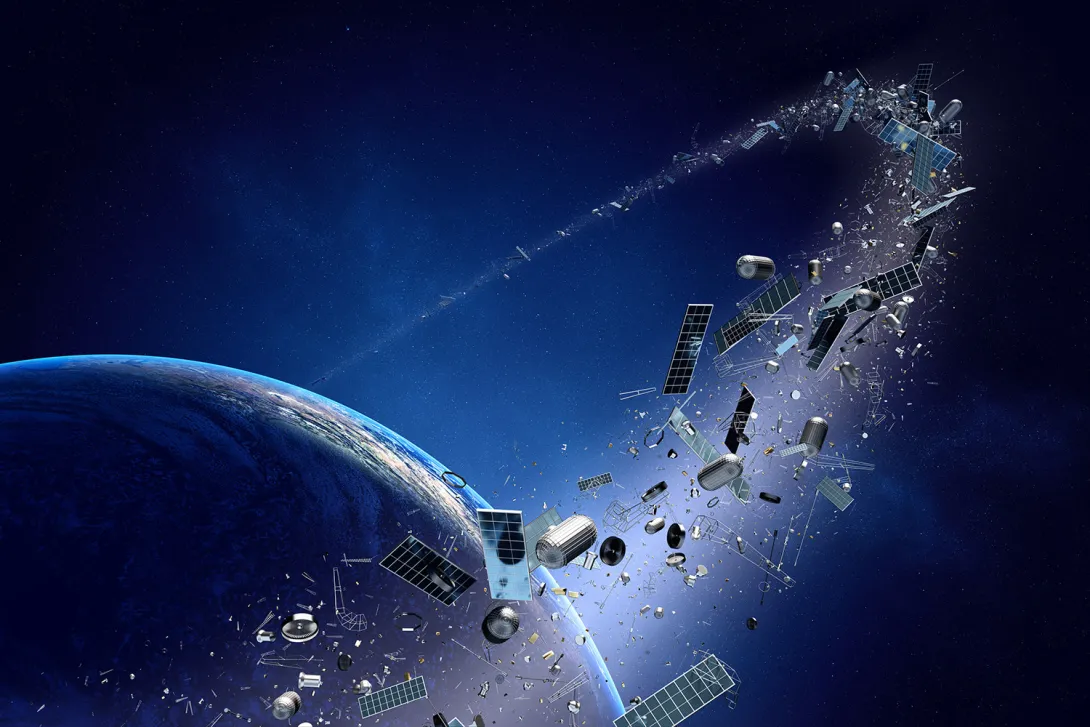 <p>Debris presents not only a physical hazard but also a complex issue for satellite operators trying to navigate these invisible threats. (Credit: Adobe Stock)</p> An illustrative image of Earth with debris orbiting around it